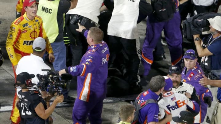 MARTINSVILLE, VIRGINIA - OCTOBER 27: Denny Hamlin, driver of the #11 FedEx Freight Toyota, Joey Logano, driver of the #22 Shell Pennzoil Ford, and their crews have an altercation on pit lane following the Monster Energy NASCAR Cup Series First Data 500 at Martinsville Speedway on October 27, 2019 in Martinsville, Virginia. (Photo by Brian Lawdermilk/Getty Images)
