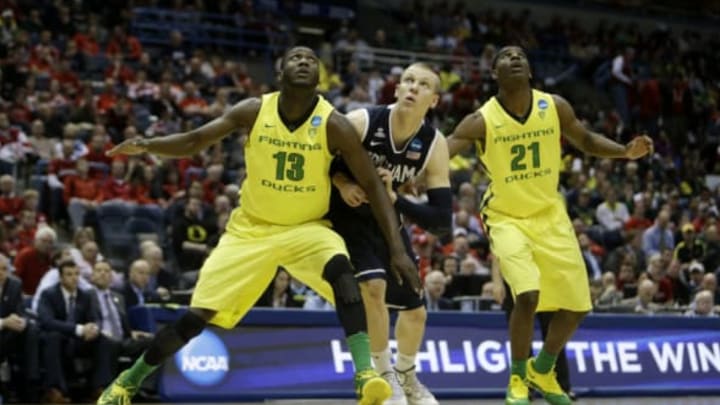 MILWAUKEE, WI – MARCH 20: Richard Amardi #13 of the Oregon Ducks and Damyean Dotson #21 box out for the rebound against the BYU Cougers during the second round of the 2014 NCAA Men’s Basketball Tournament at BMO Harris Bradley Center on March 20, 2014 in Madison, Wisconsin. (Photo by Mike McGinnis/Getty Images)