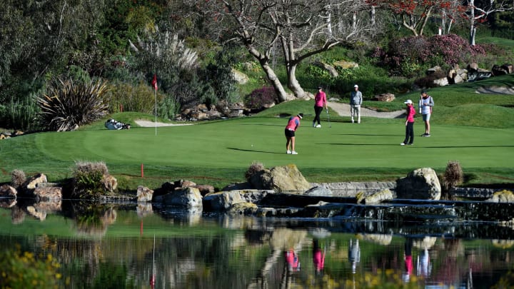 CARLSBAD, CALIFORNIA – MARCH 29: Megan Khang hits her putt as Carlota Ciganda of Spain and Stacy Lewis look on during the second round of the Kia Classic at the Aviara Golf Club on March 29, 2019 in Carlsbad, California. (Photo by Steve Dykes/Getty Images)