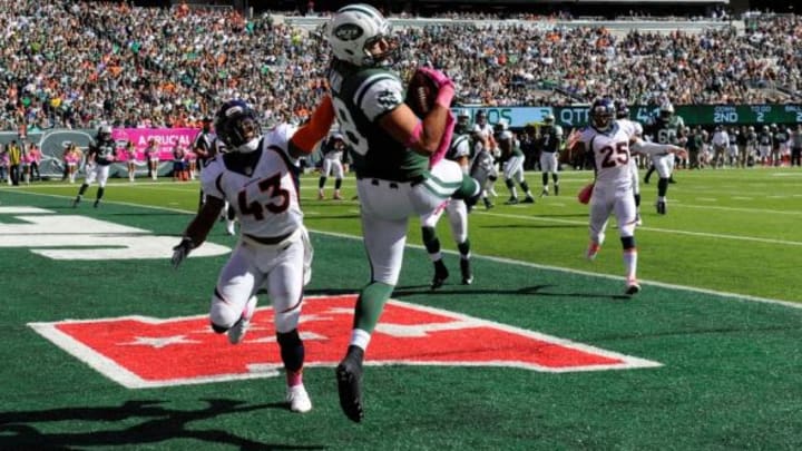 Oct 12, 2014; East Rutherford, NJ, USA; New York Jets tight end Jace Amaro (88) scores a touchdown defended by Denver Broncos strong safety T.J. Ward (43) during the first half at MetLife Stadium. Mandatory Credit: Robert Deutsch-USA TODAY Sports