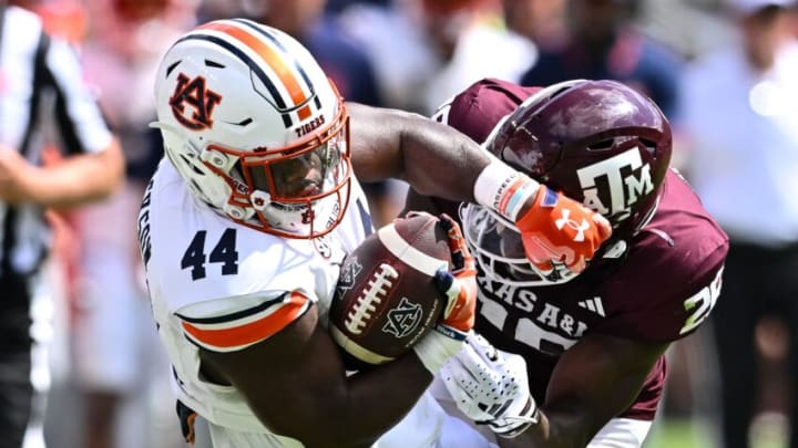 Sep 23, 2023; College Station, Texas, USA; Texas A&M Aggies defensive back Demani Richardson (26) tackles Auburn Tigers running back Sean Jackson (44) during the fourth quarter at Kyle Field. Mandatory Credit: Maria Lysaker-USA TODAY Sports