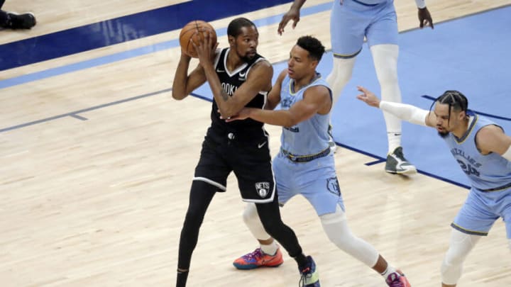 Mar 23, 2022; Memphis, Tennessee, USA; Brooklyn Nets forward Kevin Durant (7) controls the ball as Memphis Grizzlies guard Desmond Bane (22) defends during the first half at FedExForum. (Petre Thomas-USA TODAY Sports)