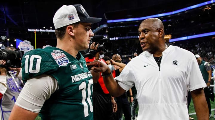 Michigan State coach Mel Tucker talks to quarterback Payton Thorne after the 31-21 win over Pittsburgh in the Peach Bowl at the Mercedes-Benz Stadium in Atlanta on Thursday, Dec. 30, 2021.12302021 Peacbowlextra 9 Payton Thorne, Mel Tucker