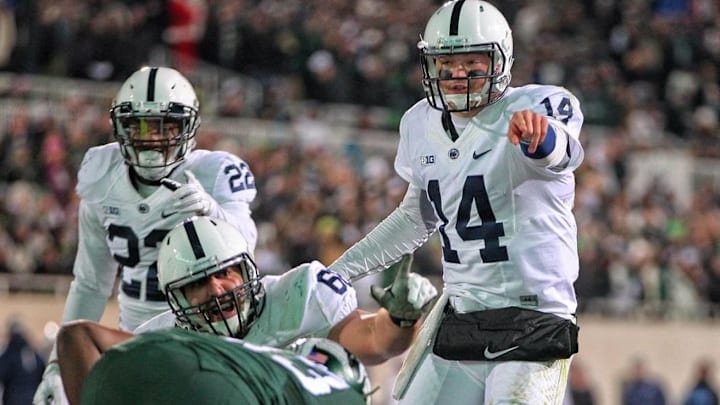 Nov 28, 2015; East Lansing, MI, USA; Penn State Nittany Lions quarterback Christian Hackenberg (14) gestures to the Michigan State Spartans defense during the second half of a game at Spartan Stadium. Mandatory Credit: Mike Carter-USA TODAY Sports