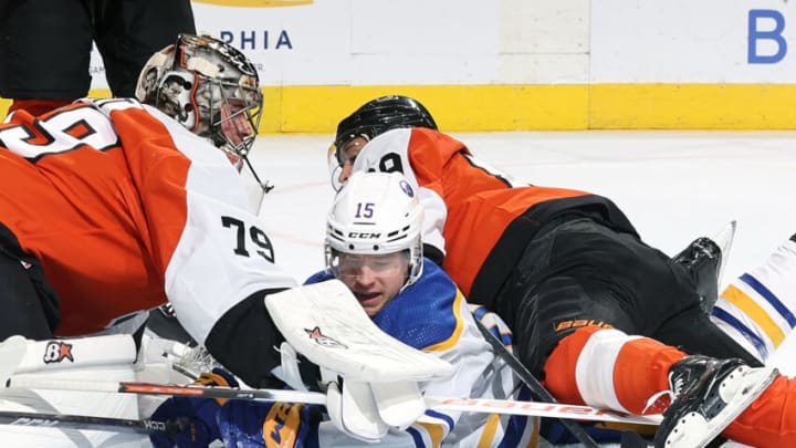 PHILADELPHIA, PENNSYLVANIA - NOVEMBER 01: Brandon Biro #15 of the Buffalo Sabres collides with Carter Hart #79 and Cam Atkinson #89 of the Philadelphia Flyers after scoring during the first period at the Wells Fargo Center on November 01, 2023 in Philadelphia, Pennsylvania. Biro scored his first-career NHL goal. (Photo by Tim Nwachukwu/Getty Images)