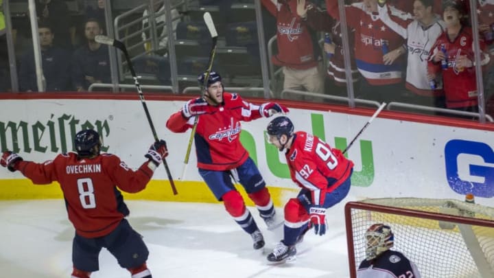 WASHINGTON, DC - APRIL 21: Washington Capitals right wing Tom Wilson (43) and left wing Alex Ovechkin (8) celebrate the second goal by center Evgeny Kuznetsov (92) in the second period during the first round Stanley Cup playoff game 5 between the Washington Capitals and the Columbus Blue Jackets on April 21, 2018, at Capital One Arena, in Washington, D.C. The Capitals defeated the Blue Jackets 4-3 in overtime.(Photo by Tony Quinn/Icon Sportswire via Getty Images)