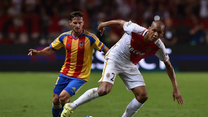 MONACO - AUGUST 25: Fabinho (R) of Monaco in action against Pablo Piatti of Valencia during the UEFA Champions League qualifying round play off second leg match between Monaco and Valencia on August 25, 2015 in Monaco, Monaco. (Photo by Valerio Pennicino/Getty Images)