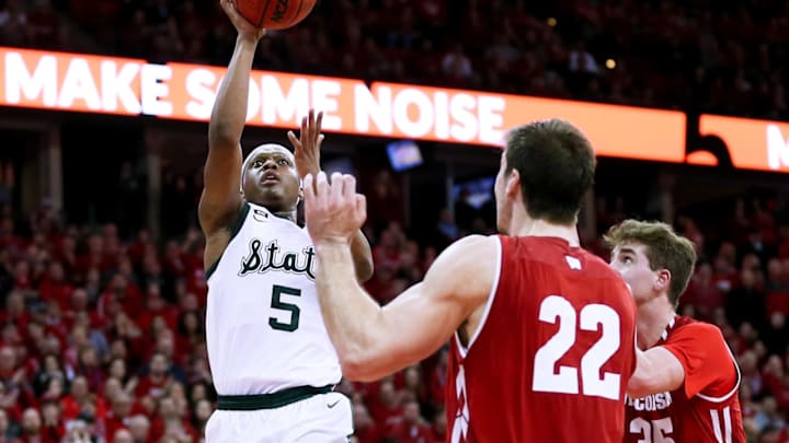 MADISON, WISCONSIN – FEBRUARY 12: Cassius Winston #5 of the Michigan State Spartans attempts a shot while being guarded by Ethan Happ #22 of the Wisconsin Badgers in the second half at the Kohl Center on February 12, 2019 in Madison, Wisconsin. (Photo by Dylan Buell/Getty Images)