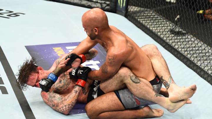 CHICAGO, ILLINOIS - JUNE 09: (R-L) Mike Jackson punches CM Punk in their welterweight fight during the UFC 225 event at the United Center on June 9, 2018 in Chicago, Illinois. (Photo by Josh Hedges/Zuffa LLC/Zuffa LLC via Getty Images)