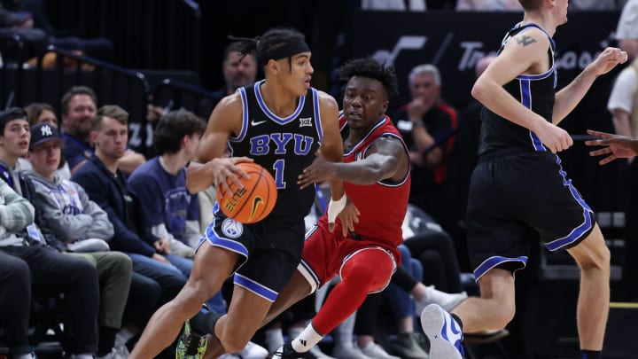 Dec 1, 2023; Salt Lake City, Utah, USA; Brigham Young Cougars guard Trey Stewart (1) drives the ball against Fresno State Bulldogs guard Jalen Weaver (5) during the second half at Delta Center. Mandatory Credit: Rob Gray-USA TODAY Sports