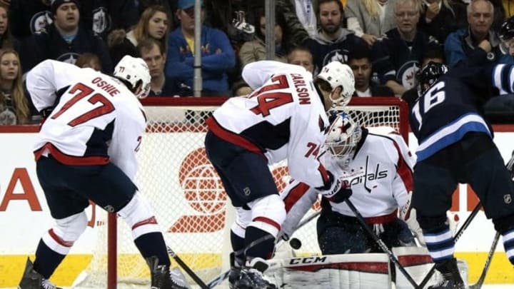 Dec 5, 2015; Winnipeg, Manitoba, CAN; Winnipeg Jets left wing Andrew Ladd (16) shoots on Washington Capitals goalie Braden Holtby (70) in first period at MTS Centre. Mandatory Credit: James Carey Lauder-USA TODAY Sports