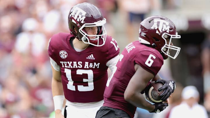 COLLEGE STATION, TEXAS - SEPTEMBER 03: Haynes King #13 of the Texas A&M Aggies hands the ball off to Devon Achane #6 of the Texas A&M Aggies during the first half against the Sam Houston State Bearkats at Kyle Field on September 03, 2022 in College Station, Texas. (Photo by Carmen Mandato/Getty Images)