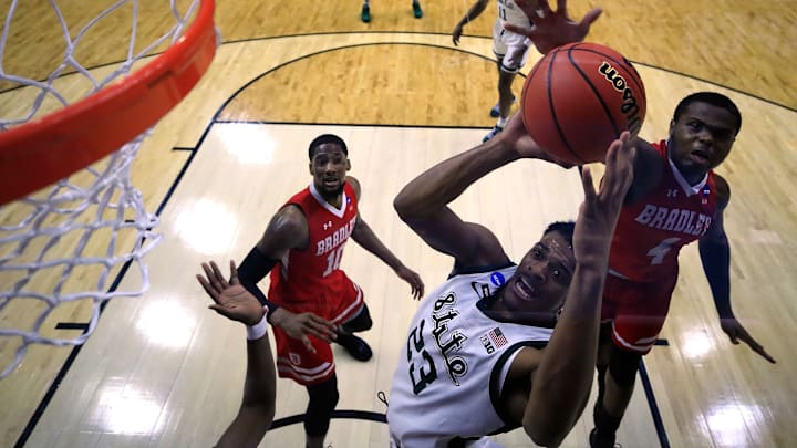 DES MOINES, IOWA – MARCH 21: Xavier Tillman #23 of the Michigan State Spartans is defended by Armon Brummett #4 of the Bradley Braves during their game in the First Round of the NCAA Basketball Tournament at Wells Fargo Arena on March 21, 2019 in Des Moines, Iowa. (Photo by Andy Lyons/Getty Images)