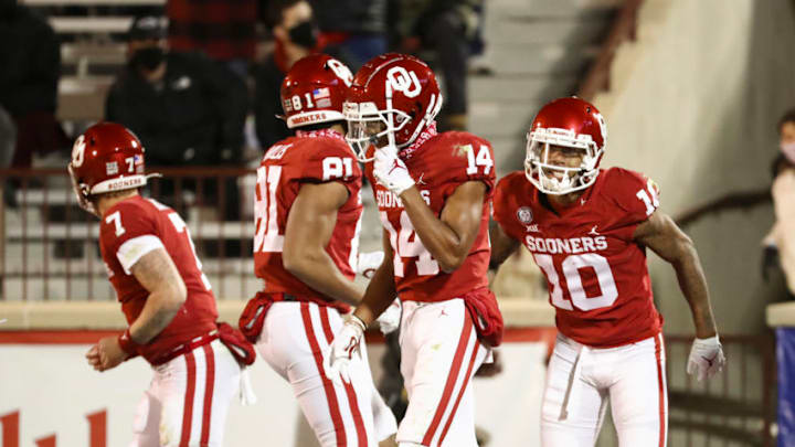Dec 5, 2020; Norman, Oklahoma, USA; Oklahoma Sooners wide receiver Theo Wease (10) celebrates with teammates after scoring during the second half against the Baylor Bears at Gaylord Family-Oklahoma Memorial Stadium. Mandatory Credit: Kevin Jairaj-USA TODAY Sports