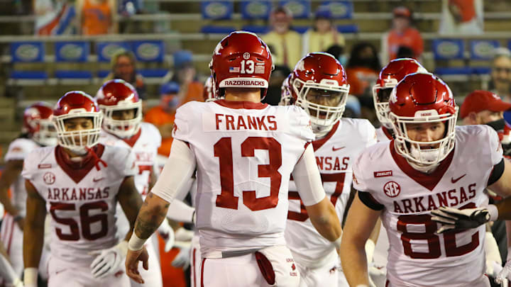 Nov 14, 2020; Gainesville, FL, USA; Arkansas quarterback and former Florida Gators player Feleipe Franks (13) leads his team out onto the field for warm-ups before a football game against Florida at Ben Hill Griffin Stadium. Mandatory Credit: Brad McClenny-USA TODAY NETWORK