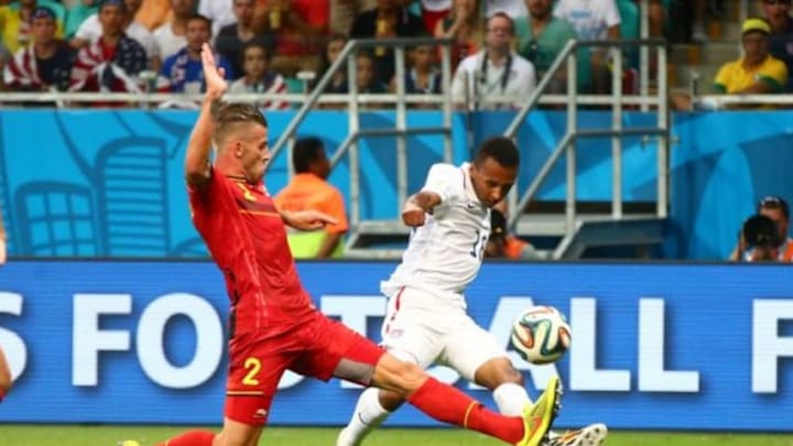Jul 1, 2014; Salvador, BRAZIL; United States midfielder Julian Green (16) takes a shot on goal against Belgium defender Toby Alderweireld (2) in overtime during the round of sixteen match in the 2014 World Cup at Arena Fonte Nova. Belgium defeated USA 2-1 in overtime. Mandatory Credit: Mark J. Rebilas-USA TODAY Sports