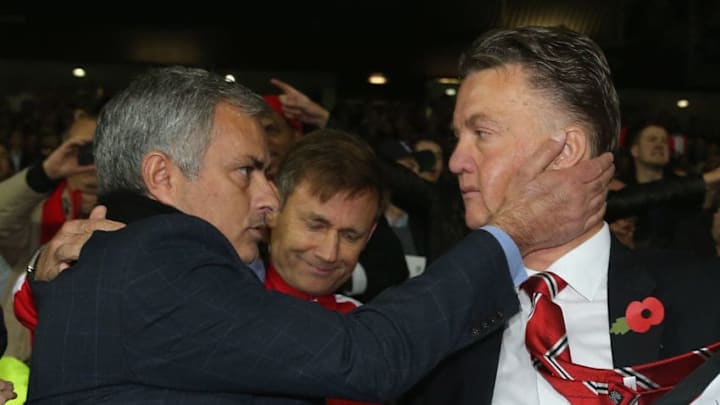 MANCHESTER, ENGLAND - OCTOBER 26: Manager Louis van Gaal of Manchester United and Manager Jose Mourinho of Chelsea embrace after the Barclays Premier League match between Manchester United and Chelsea at Old Trafford on October 26, 2014 in Manchester, England. (Photo by John Peters/Man Utd via Getty Images)