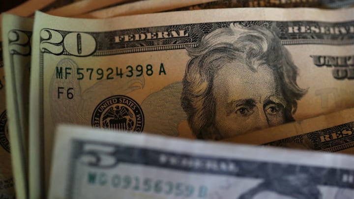 SAN ANSELMO, CA - AUGUST 29: In this Photo Illustration, Twenty and five dollar bills are displayed on August 29, 2017 in San Anselmo, California. The dollar fell to a two and a half year low to 91.77 Tuesday following the latest missile launch by North Korea. The U.S. dollar index has slipped over 10% since the inauguration of U.S. President Donald Trump. (Photo Illustration by Justin Sullivan/Getty Images)