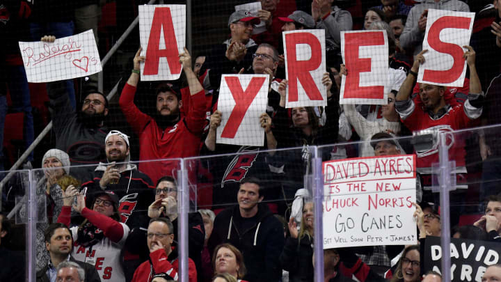 RALEIGH, NORTH CAROLINA – FEBRUARY 25: Fans cheer for Dave Ayres during the game between the Dallas Stars and Carolina Hurricanes at at PNC Arena on February 25, 2020 in Raleigh, North Carolina.  (Photo by Grant Halverson/Getty Images)