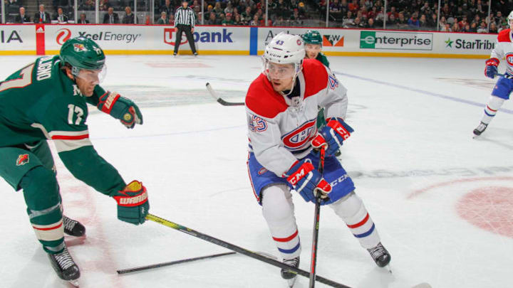 SAINT PAUL, MN - OCTOBER 20: Jordan Weal #43 of the Montreal Canadiens skates with the puck while Marcus Foligno #17 of the Minnesota Wild defends during the game at the Xcel Energy Center on October 20, 2019 in Saint Paul, Minnesota. (Photo by Bruce Kluckhohn/NHLI via Getty Images)