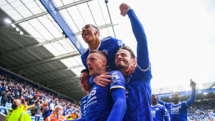 LEICESTER, ENGLAND - MAY 23: Jamie Vardy of Leicester City celebrates with teammates Luke Thomas, James Maddison and Youri Tielemans in front of the Leicester City fans after scoring his team's second goal during the Premier League match between Leicester City and Tottenham Hotspur at The King Power Stadium on May 23, 2021 in Leicester, England. A limited number of fans will be allowed into Premier League stadiums as Coronavirus restrictions begin to ease in the UK. (Photo by Laurence Griffiths/Getty Images)