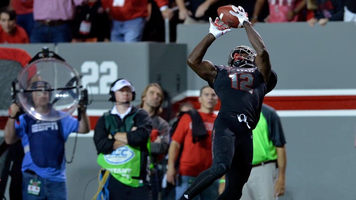 RALEIGH, NC – OCTOBER 05: Stephen Louis #12 of the North Carolina State Wolfpack makes a leaping catch against the Louisville Cardinals during the game at Carter Finley Stadium on October 5, 2017 in Raleigh, North Carolina. (Photo by Grant Halverson/Getty Images)