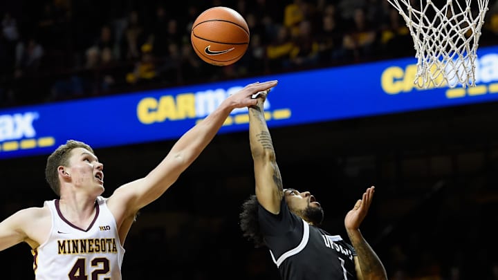 MINNEAPOLIS, MN – NOVEMBER 10: Michael Hurt #42 of the Minnesota Golden Gophers fouls Mike Cunningham #1 of the USC Upstate Spartans while shooting the ball during the second half of the game on November 10, 2017 at Williams Arena in Minneapolis, Minnesota. The Golden Gophers defeated the Spartans 92-77. (Photo by Hannah Foslien/Getty Images)