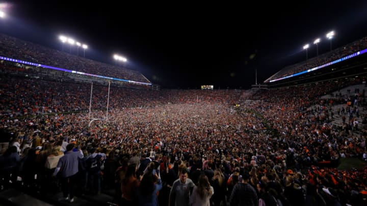 AUBURN, AL - NOVEMBER 25: Auburn Tigers fans storm the field in celebration after the victory over the Alabama Crimson Tide at Jordan Hare Stadium on November 25, 2017 in Auburn, Alabama. (Photo by Kevin C. Cox/Getty Images)