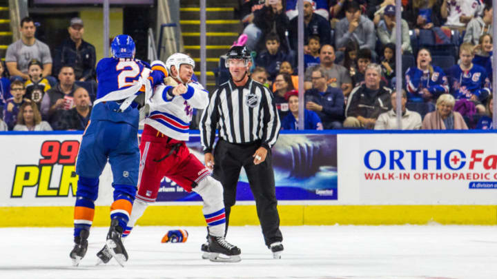 BRIDGEPORT, CT - SEPTEMBER 22: New York Islanders Defenseman Scott Mayfield #24 and New York Rangers Winger Cody McLeod #8 go toe to toe during the first period of a preseason NHL game between the New York Rangers and the New York Islanders on September 22, 2018, at Webster Bank Arena in Bridgeport, CT. (Photo by David Hahn/Icon Sportswire via Getty Images)