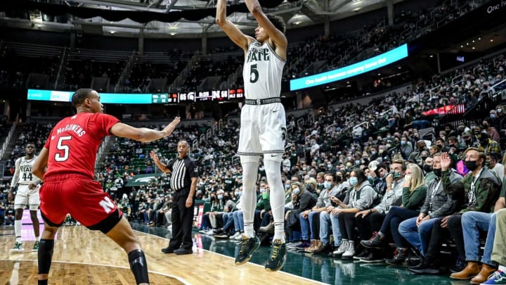 Michigan State’s Max Christie, right, makes a 3-pointer as Nebraska’s Bryce McGowens, left, closes in during the second half on Wednesday, Jan. 5, 2022, at the Breslin Center in East Lansing.220105 Msu Neb 170a