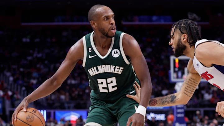 Mar 27, 2023; Detroit, Michigan, USA; Milwaukee Bucks forward Khris Middleton (22) dribbles defended by Detroit Pistons forward Isaiah Livers (12) in the second half at Little Caesars Arena. Mandatory Credit: Rick Osentoski-USA TODAY Sports