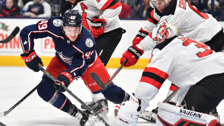 COLUMBUS, OH - DECEMBER 21: Ryan MacInnis #49 of the Columbus Blue Jackets shoots the puck on goaltender Gilles Senn #31 of the New Jersey Devils during the first period of a game on December 21, 2019 at Nationwide Arena in Columbus, Ohio. (Photo by Jamie Sabau/NHLI via Getty Images)