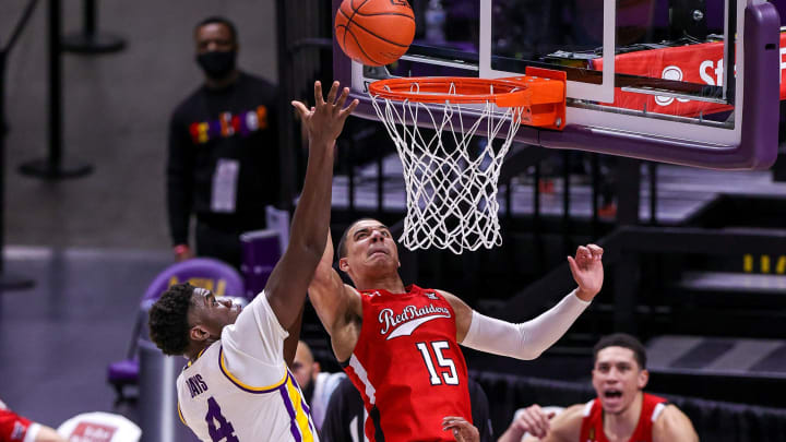 Jan 30, 2021; Baton Rouge, Louisiana, USA; Texas Tech Red Raiders guard Kevin McCullar (15) shoots over LSU Tigers forward Darius Days (4) during the second half at Pete Maravich Assembly Center. Mandatory Credit: Stephen Lew-USA TODAY Sports