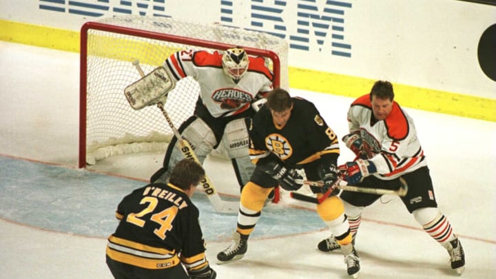 19 Jan 1996: Terry O”Reilly #24 of the Boston Bruin Heroes gets ready to take a shot while teammate Peter McNab #8 fends off Denis Potvin #5 of the NHL Heroes in an attempt to score past goalie John Garrett #31 during the second period of the NHL Heroes
