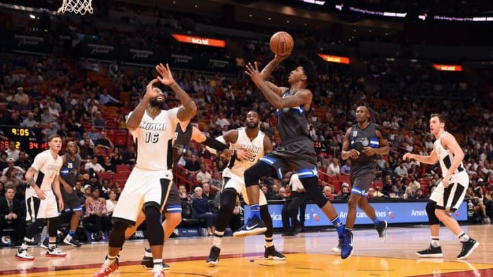 Dec 20, 2016; Miami, FL, USA; Orlando Magic guard Elfrid Payton (4) drives to the basket as Miami Heat forward James Johnson (16) defends during the first half at American Airlines Arena. Mandatory Credit: Steve Mitchell-USA TODAY Sports