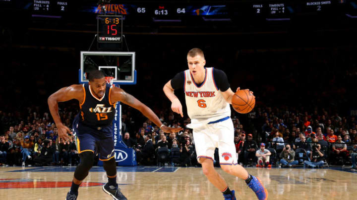 NEW YORK, NY - NOVEMBER 6: Kristaps Porzingis #6 of the New York Knicks drives to the basket against Derrick Favors #15 of the Utah Jazz during the game on November 6, 2016 at Madison Square Garden in New York City, New York. Copyright 2016 NBAE (Photo by Nathaniel S. Butler/NBAE via Getty Images)