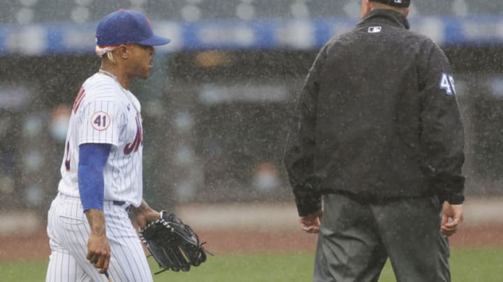 NEW YORK, NEW YORK - APRIL 11: Marcus Stroman #0 of the New York Mets talks with umpire Ron Kulpa #46 while pitching during the first inning against the Miami Marlins at Citi Field on April 11, 2021 in the Queens borough of New York City. (Photo by Sarah Stier/Getty Images)