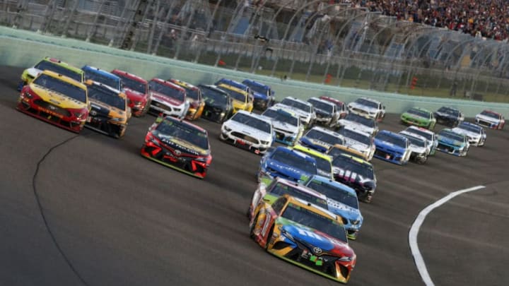 HOMESTEAD, FLORIDA - NOVEMBER 17: Kyle Busch, driver of the #18 M&M's Toyota, leads a pack of cars during the Monster Energy NASCAR Cup Series Ford EcoBoost 400 at Homestead Speedway on November 17, 2019 in Homestead, Florida. (Photo by Brian Lawdermilk/Getty Images)