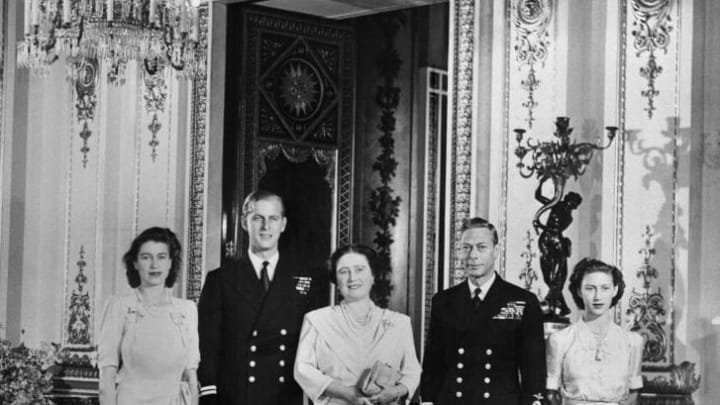 Princess Elizabeth, Philip Mountbatten, Queen Elizabeth (the future Queen Mother), King George VI, and Princess Margaret pose in Buckingham Palace on July 9, 1947, the day the engagement of Princess Elizabeth & Philip Mountbatten was officially announced.