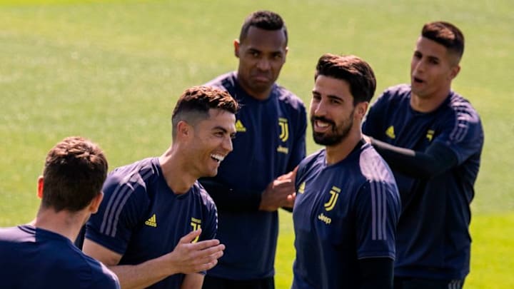 Juventus' Portuguese forward Cristiano Ronaldo (2nd L) share a laugh with teammates during a training session on the eve of the UEFA Champions League football match Ajax vs Juventus on April 9, 2019 at the Juventus Training Center in Turin. (Photo by MARCO BERTORELLO / AFP) (Photo credit should read MARCO BERTORELLO/AFP via Getty Images)
