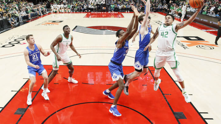 Nov 16, 2021; Portland, Oregon, USA; Oregon Ducks guard Jacob Young (42) shoots the ball as BYU Cougar guard Trevin Knell (21) defends during the first half at Moda Center. Mandatory Credit: Soobum Im-USA TODAY Sports