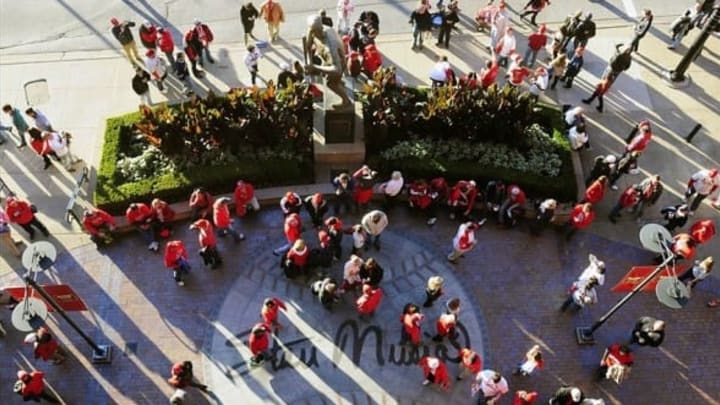 Oct 27, 2013; St. Louis, MO, USA; Fans wait outside Busch Stadium near the Stan Musial statue prior to game four of the MLB baseball World Series between the Boston Red Sox and the St. Louis Cardinals. Mandatory Credit: Jeff Curry-USA TODAY Sports