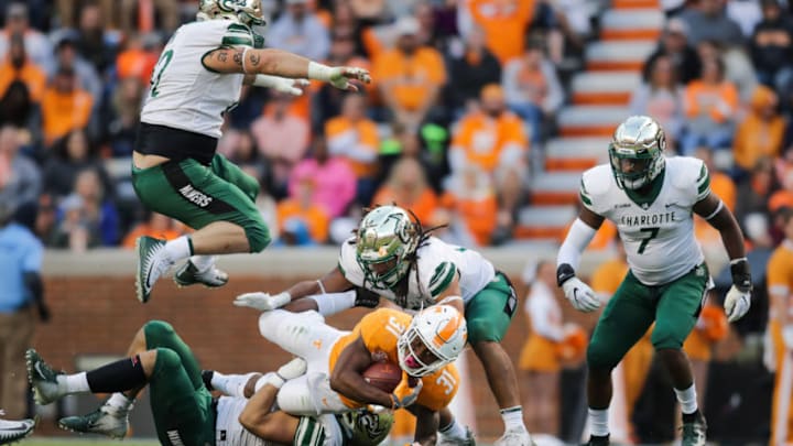 KNOXVILLE, TN - NOVEMBER 3: Tyler Fain #62 of the Charlotte 49ers rumps in the air as Running back Madre London #31 of the Tennessee Volunteers is tackled during the game between the Charlotte 49ers and the Tennessee Volunteers at Neyland Stadium on November 3, 2018 in Knoxville, Tennessee. Tennessee won the game 14-3. (Photo by Donald Page/Getty Images)