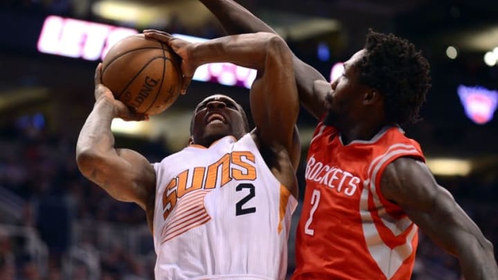 Feb 10, 2015; Phoenix, AZ, USA; Phoenix Suns guard Eric Bledsoe (2) attempts to shoot the ball as Houston Rockets guard Patrick Beverley (2) defends at US Airways Center. Mandatory Credit: Joe Camporeale-USA TODAY Sports