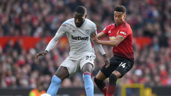 MANCHESTER, ENGLAND - APRIL 13: Arthur Masuaku of West Ham United is challenged by Jesse Lingard of Manchester United during the Premier League match between Manchester United and West Ham United at Old Trafford on April 13, 2019 in Manchester, United Kingdom. (Photo by Gareth Copley/Getty Images)