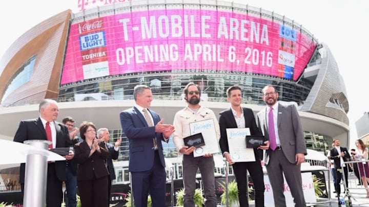 LAS VEGAS, NEVADA - APRIL 06: Clark County Commission Chairman Steve Sisolak (L), Clark County Commissioner Mary Beth Scow (2nd L), MGM Resorts International Chairman and CEO Jim Murren (3rd L) and AEG President and CEO Dan Beckerman (R) speak as drummer Ronnie Vannucci Jr. (3rd R) and frontman Brandon Flowers (2nd R) of The Killers are given ceremonial crystal keys to the Las Vegas Strip during the T-Mobile Arena grand opening news conference on the Las Vegas Strip on April 6, 2016 in Las Vegas, Nevada. (Photo by Ethan Miller/Getty Images for MGM Resorts International)