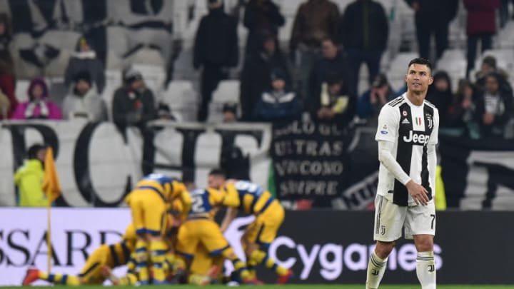 TURIN, ITALY - FEBRUARY 02: Cristiano Ronaldo (R) of Juventus looks on as Gervinho of Parma celebrates with team mates after scoring the equalizing goal (3-3) during the Serie A match between Juventus and Parma Calcio at Allianz Stadium on February 02, 2019 in Turin, Italy. (Photo by Tullio M. Puglia/Getty Images)