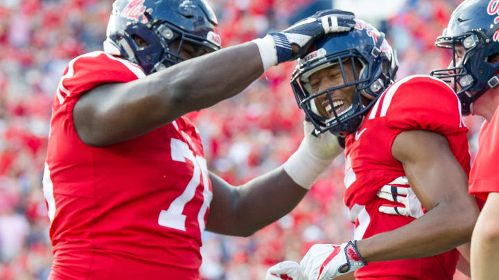 OXFORD, MS – OCTOBER 14: Wide receiver DaMarkus Lodge #5 of the Mississippi Rebels celebrates with offensive lineman Daronte Bouldin #76 of the Mississippi Rebels after scoring a touchdown during their game against the Vanderbilt Commodores at Vaught-Hemingway Stadium on October 14, 2017 in Oxford, Mississippi. (Photo by Michael Chang/Getty Images)