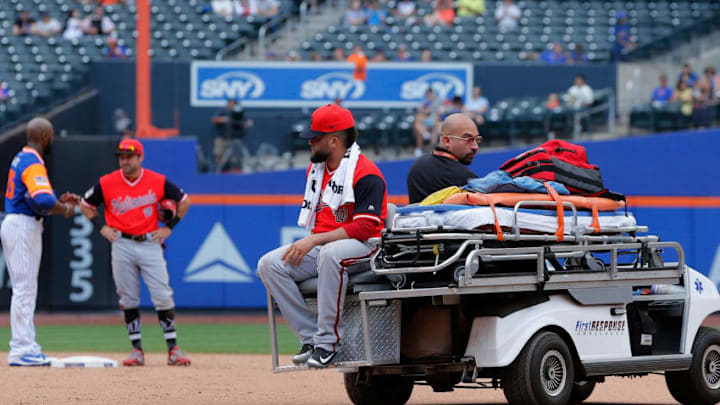 NEW YORK, NY - AUGUST 26: Kelvin Herrera #40 of the Washington Nationals is taken off the field after an injury during the ninth inning against the New York Mets at Citi Field on August 26, 2018 in the Flushing neighborhood of the Queens borough of New York City. Players are wearing special jerseys with their nicknames on them during Players' Weekend. (Photo by Jim McIsaac/Getty Images)