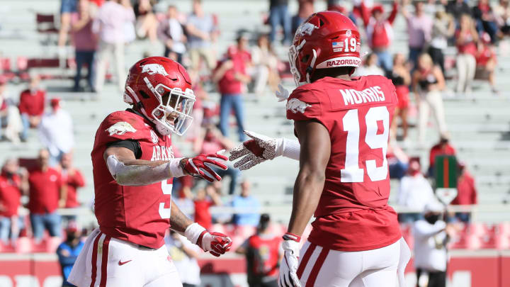 Oct 17, 2020; Fayetteville, Arkansas, USA; Arkansas Razorbacks running back Rakeem Boyb (5) celebrates with wide receiver Tyson Morris (19) after rushing for a touchdown during the first quarter against the Ole Miss Rebels at Donald W. Reynolds Razorback Stadium. Mandatory Credit: Nelson Chenault-USA TODAY Sports